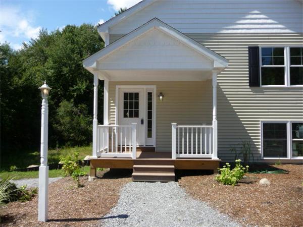 60 A Nashua Road Pepperell, MA 01463 - Photo 14 of 16 a view of a house with a small yard and a large window