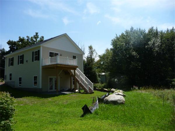60 A Nashua Road Pepperell, MA 01463 - Photo 15 of 16 a front view of a house with garden