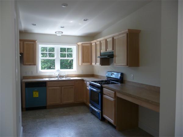 60 A Nashua Road Pepperell, MA 01463 - Photo 2 of 16 a kitchen with stainless steel appliances granite countertop a stove and a sink