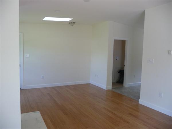 60 A Nashua Road Pepperell, MA 01463 - Photo 5 of 16 a view of an empty room with wooden floor