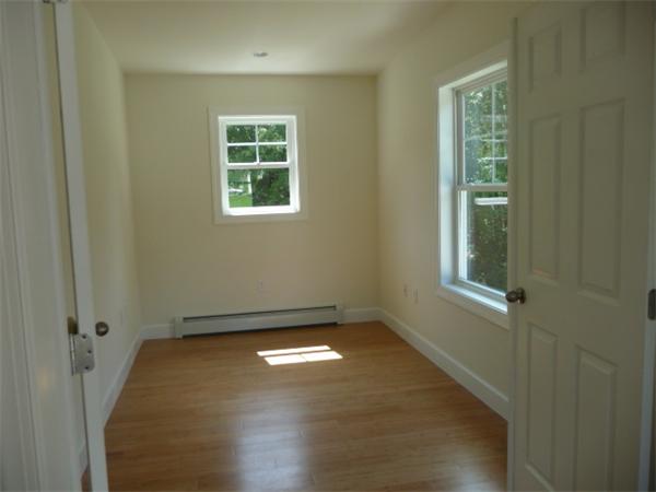 60 A Nashua Road Pepperell, MA 01463 - Photo 8 of 16 an empty room with windows
