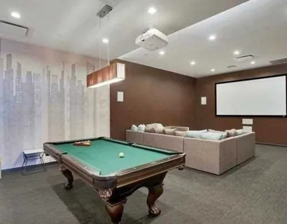 a room with gym equipment and a view of living room