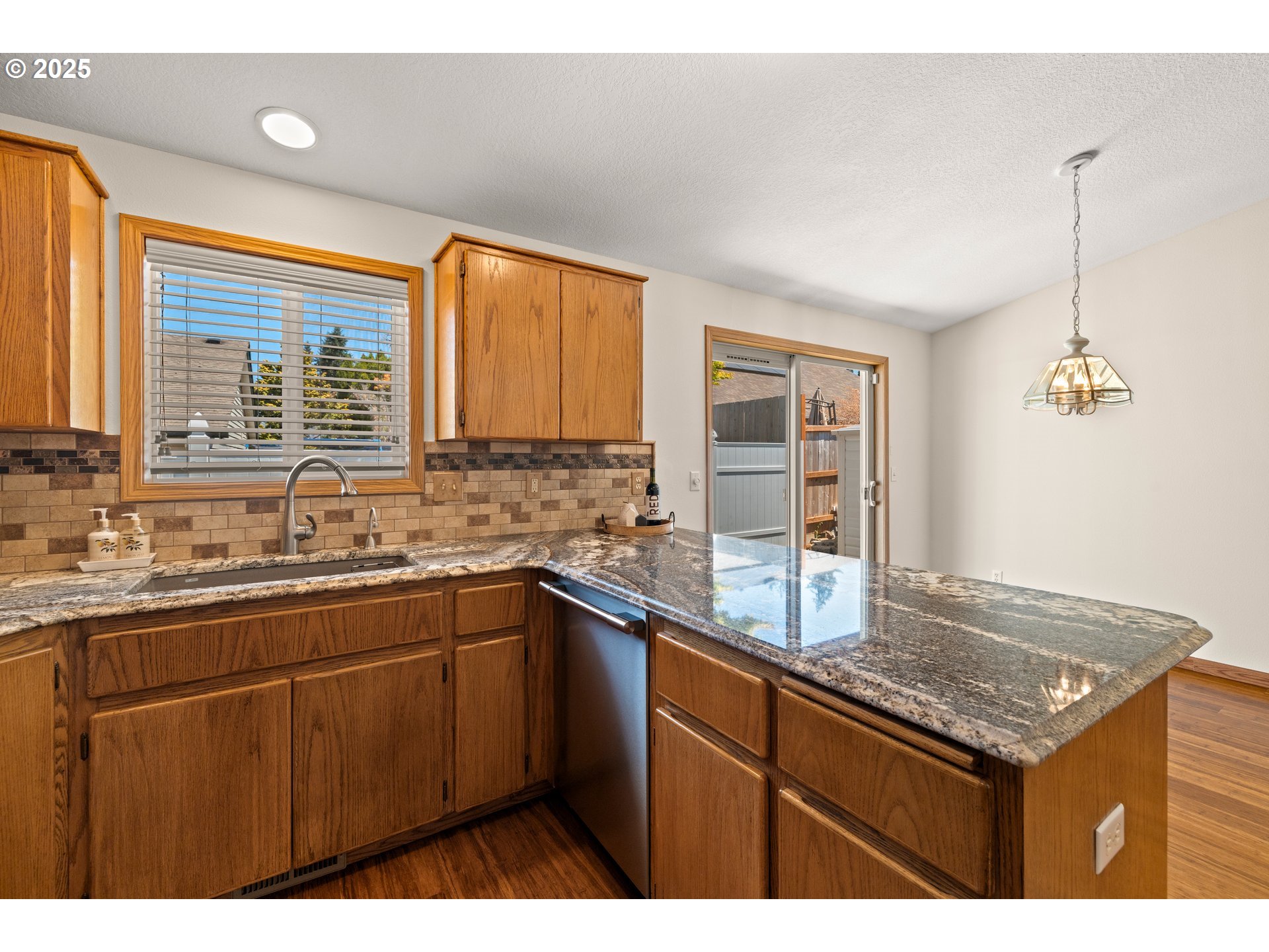 11592 Parrish Road Oregon City, OR 97045 - Photo 7 of 26 a kitchen with stainless steel appliances granite countertop a sink stove and cabinets