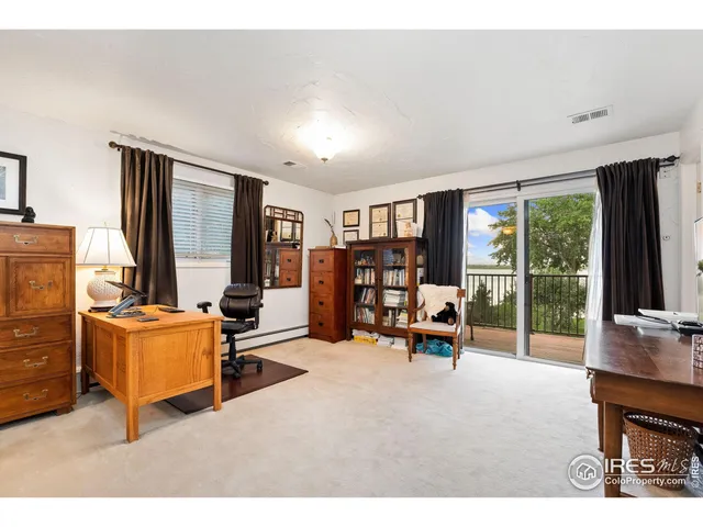 a wooden bench sitting in front of a building