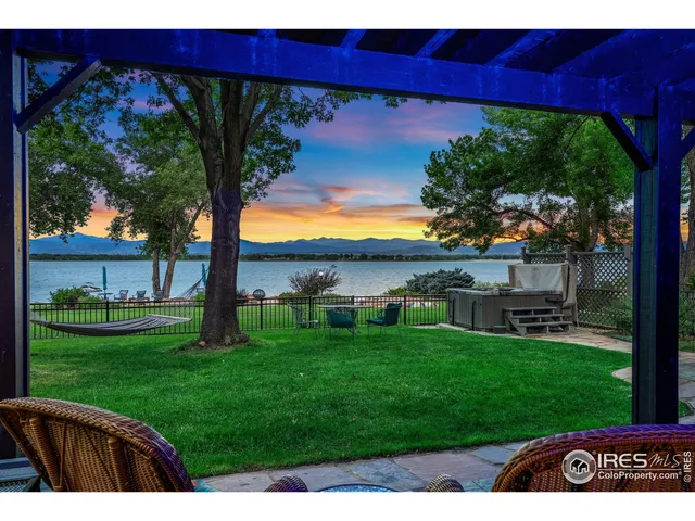 a view of a backyard with a garden and entertaining space