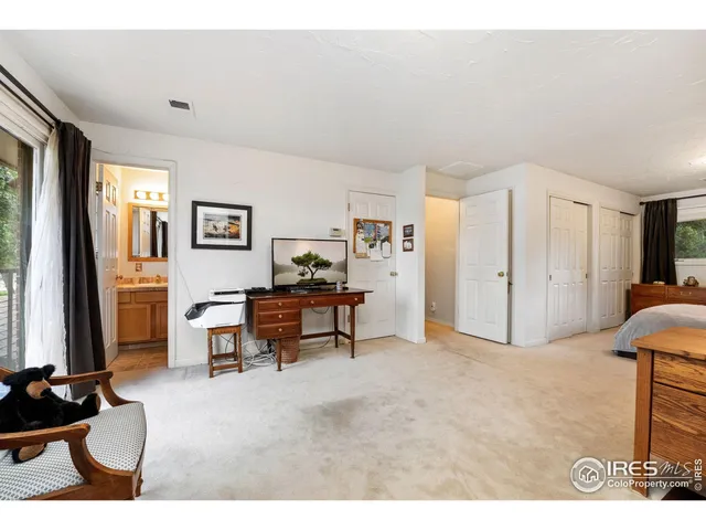 a bathroom with a granite countertop sink toilet a mirror a vanity and shower