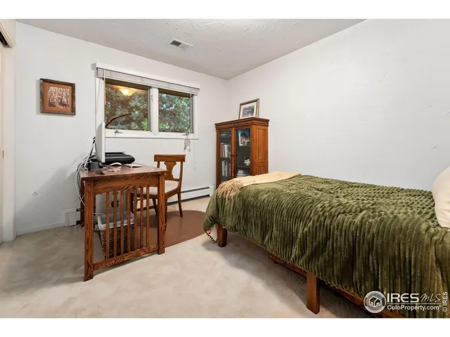 a bathroom with a granite countertop tub sink and mirror