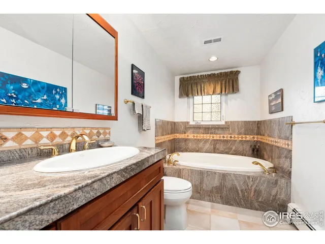 a living room with furniture a rug and a fireplace