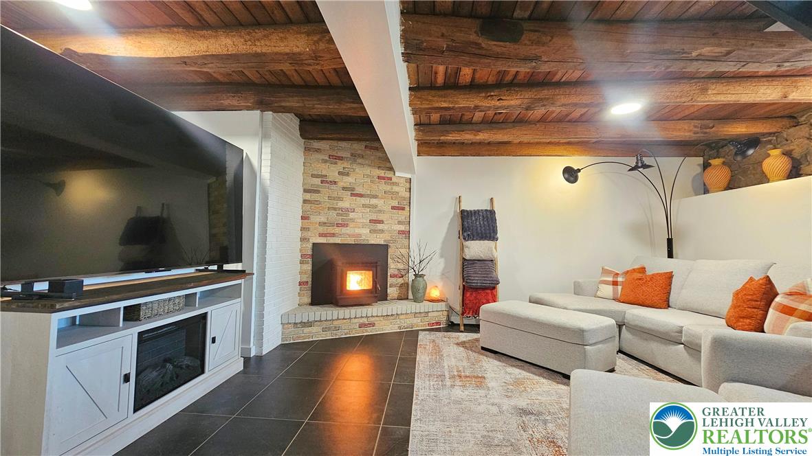 2239 Wassergass Road Hellertown, PA 18055 - Photo 16 of 42 a living room with furniture and a fireplace