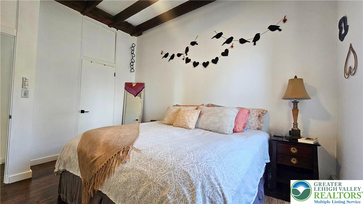 2239 Wassergass Road Hellertown, PA 18055 - Photo 23 of 42 a bedroom with a bed and a lamp on the dresser