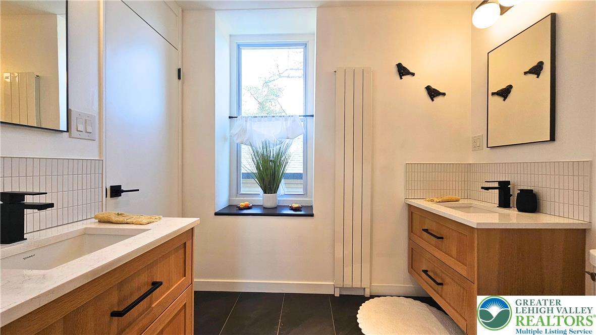 2239 Wassergass Road Hellertown, PA 18055 - Photo 25 of 42 a bathroom with a sink a toilet and shower