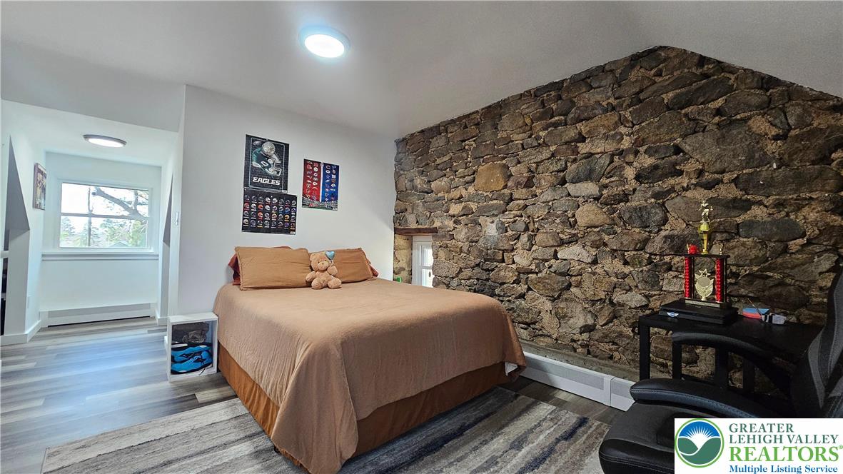 2239 Wassergass Road Hellertown, PA 18055 - Photo 32 of 42 a bedroom with a bed and a night stand