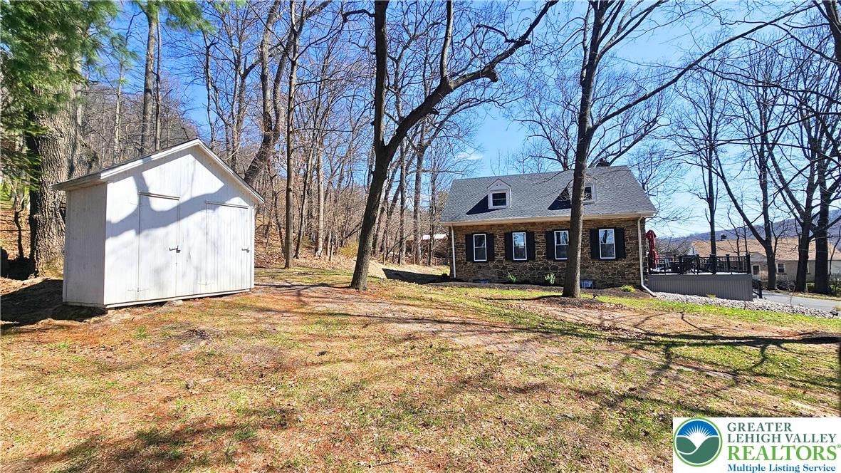 2239 Wassergass Road Hellertown, PA 18055 - Photo 37 of 42 a view of a yard with snow on the road