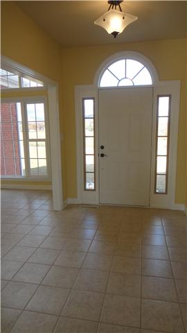 708 Barrett Road McMinnville, TN 37110 - Photo 1 of 20 Impressive arched doorway with sidelights welcomes family and guest to enter into the tiled foyer with its hanging designer light.