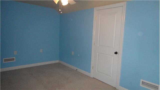 708 Barrett Road McMinnville, TN 37110 - Photo 12 of 20 Upstairs, Bedroom #4 boasts a lighted ceiling fan, ample closet space, and carpet.