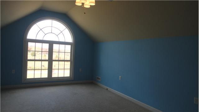 708 Barrett Road McMinnville, TN 37110 - Photo 13 of 20 Featuring an eyecatching arched window above double windows, the Upstairs boasts plenty of room for a den or playroom.