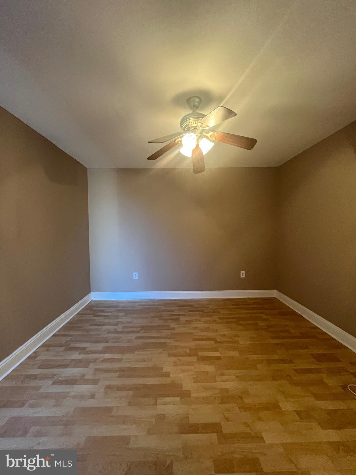 207 South 60th Street, Unit 3 Philadelphia, PA 19139 - Photo 9 of 14 a view of an empty room with a chandelier fan