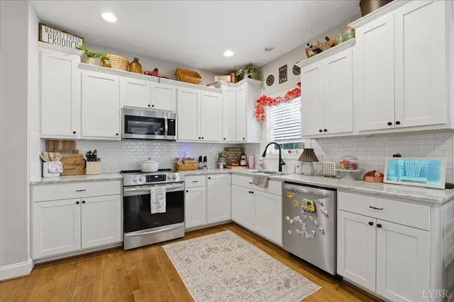 a kitchen with a stove and cabinets
