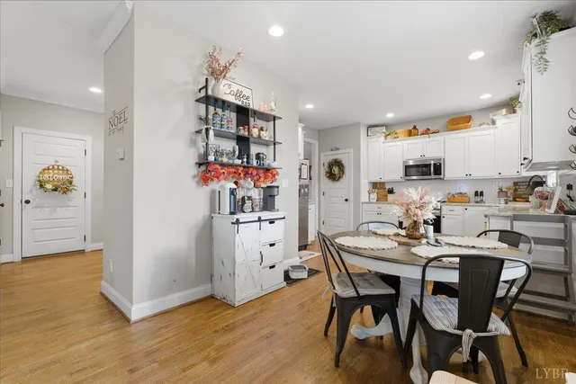 a view of a dining room with furniture chandelier and a chandelier
