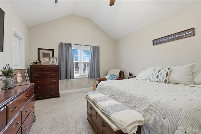 a view of walk in closet with clothes