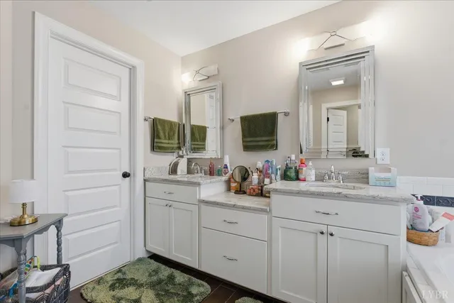 a bedroom with a bed and ceiling fan