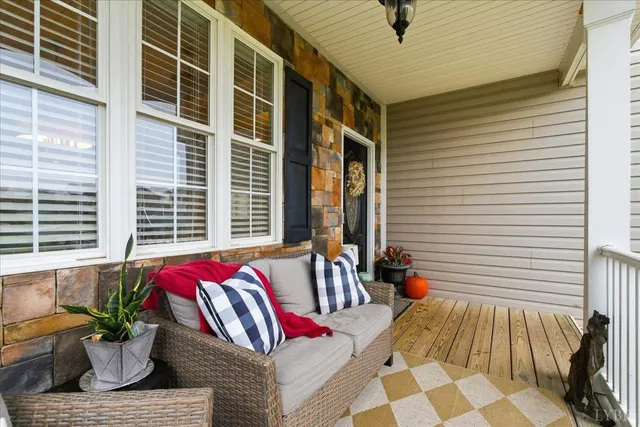 a view of balcony with furniture