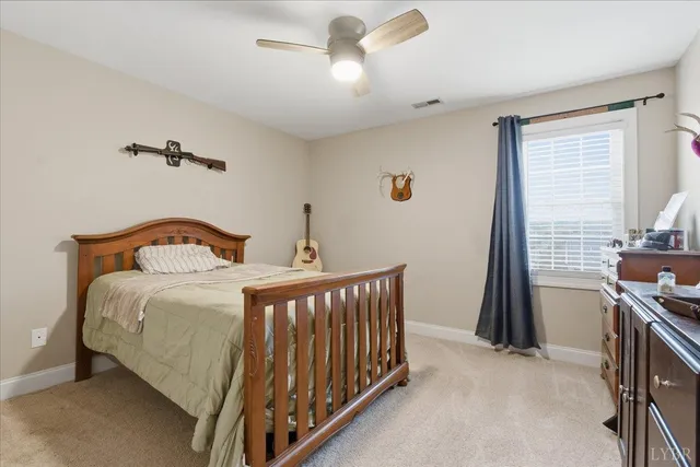 a bedroom with furniture and baby crib