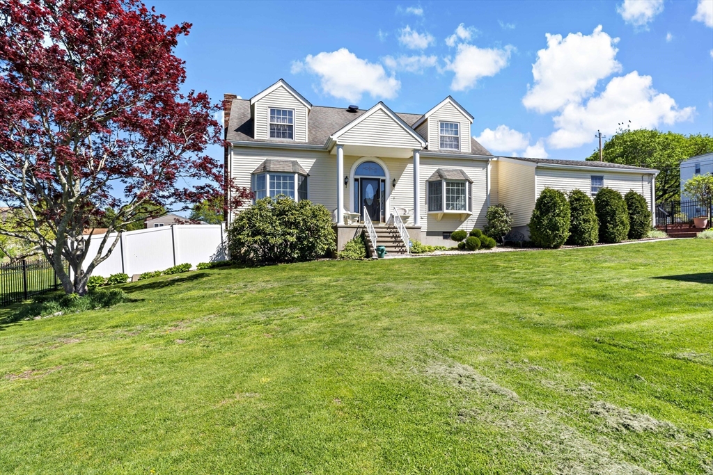 a front view of a house with a yard