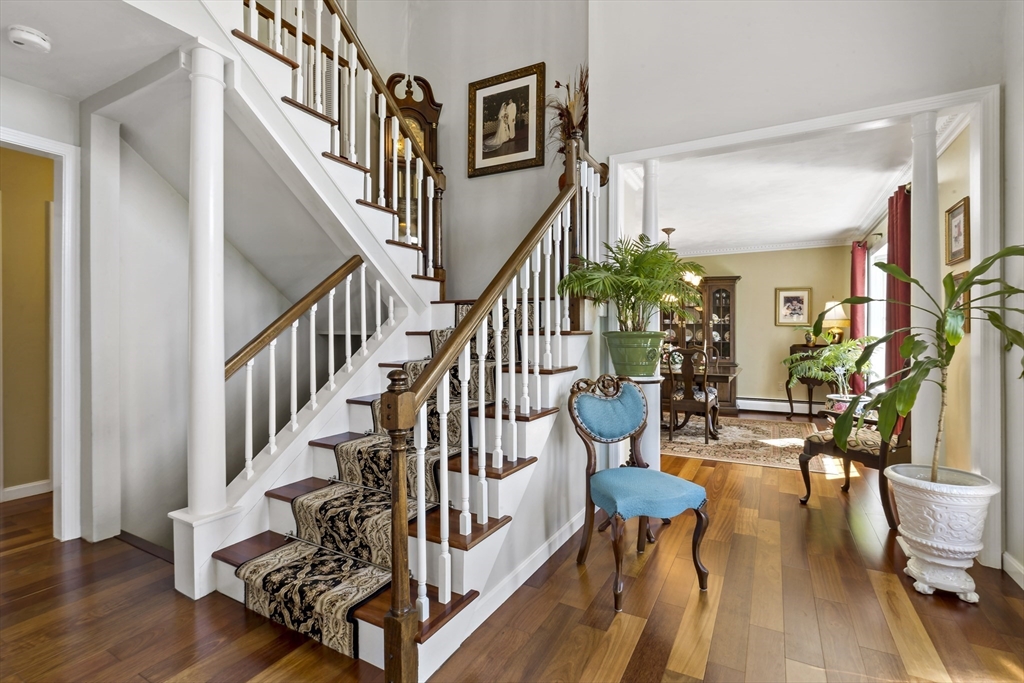 34 Howland Street Fall River, MA 02724 - Photo 18 of 42 a view of entryway and hall with wooden floor
