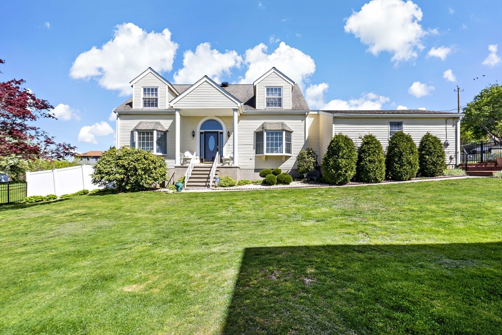 34 Howland Street Fall River, MA 02724 - Photo 2 of 42 a front view of a house with a yard