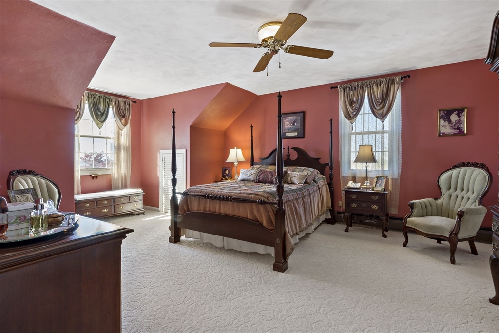 34 Howland Street Fall River, MA 02724 - Photo 29 of 42 a bedroom with a bed a couch and a window