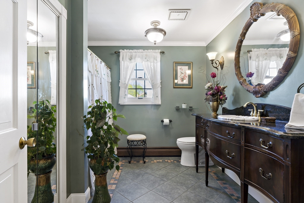 34 Howland Street Fall River, MA 02724 - Photo 33 of 42 a bathroom with a sink and a mirror