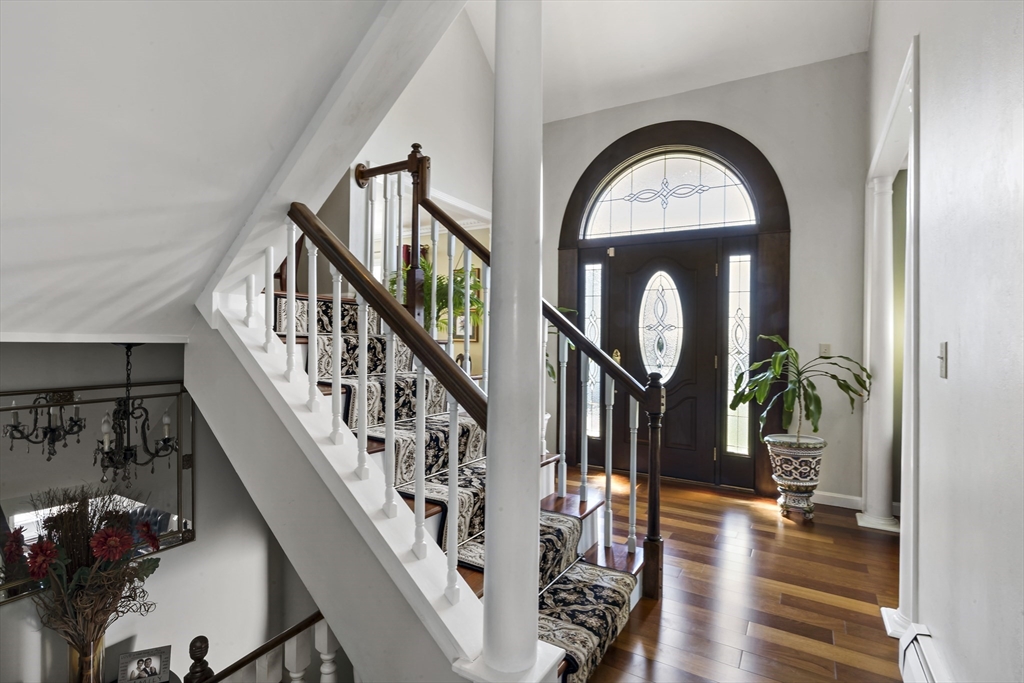 34 Howland Street Fall River, MA 02724 - Photo 34 of 42 a view of staircase with wooden floor and a potted plant