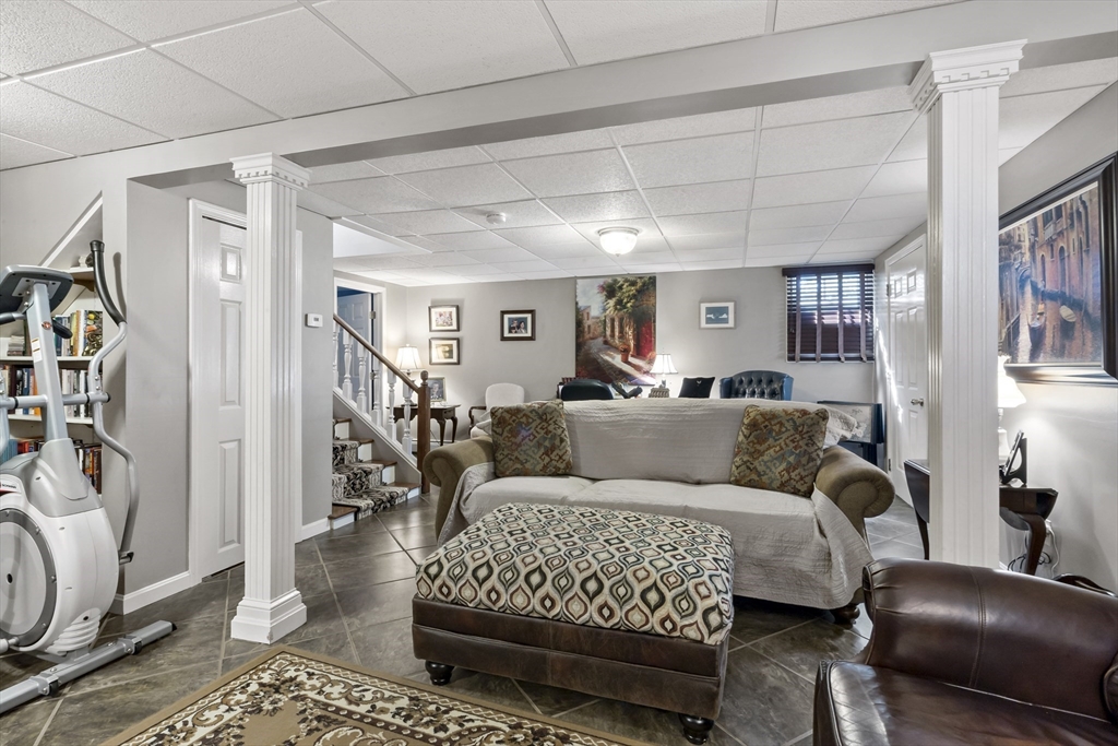 34 Howland Street Fall River, MA 02724 - Photo 35 of 42 a living room with furniture and a rug