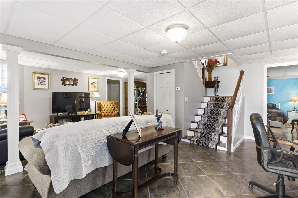 34 Howland Street Fall River, MA 02724 - Photo 36 of 42 a living room with furniture and a flat screen tv