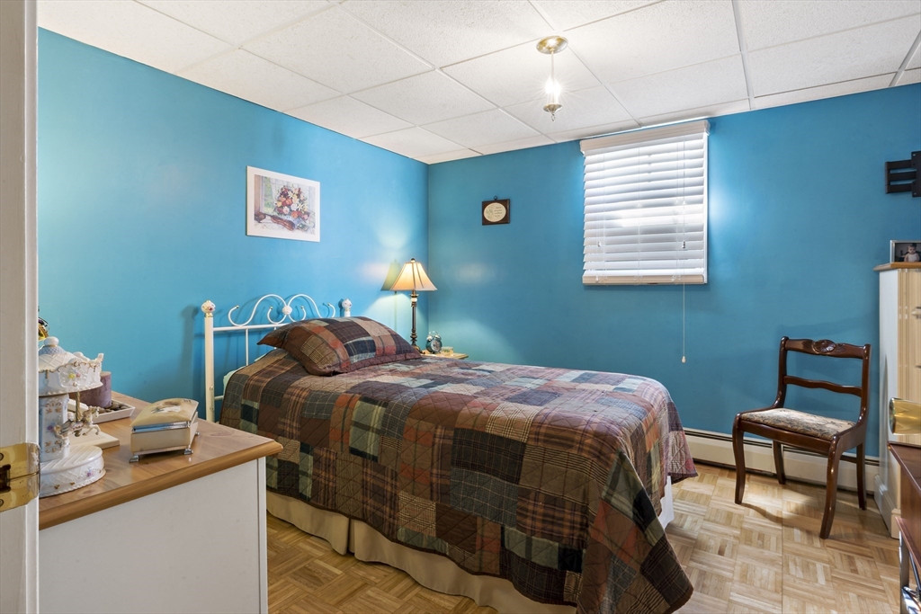 34 Howland Street Fall River, MA 02724 - Photo 41 of 42 a bedroom with a bed and a window