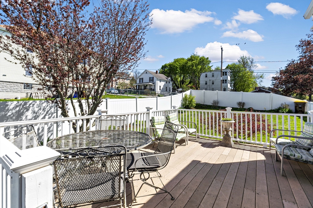 34 Howland Street Fall River, MA 02724 - Photo 7 of 42 a view of a deck with couches and wooden floor