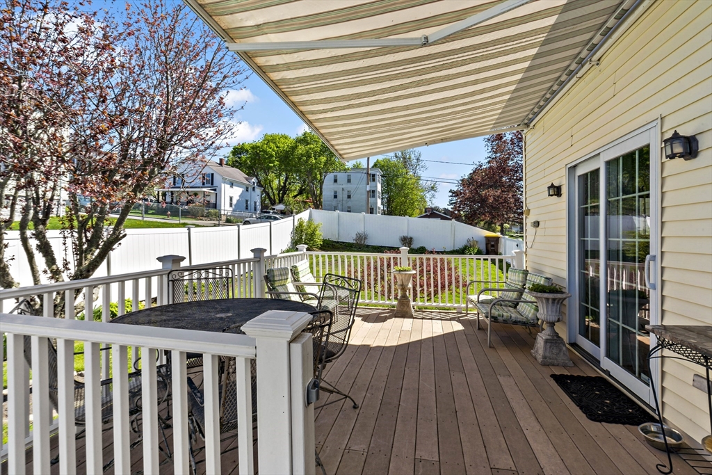 34 Howland Street Fall River, MA 02724 - Photo 8 of 42 a view of deck with furniture and trees around