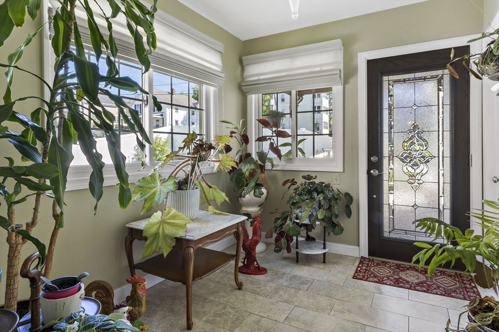 34 Howland Street Fall River, MA 02724 - Photo 9 of 42 a living room filled with furniture and a potted plant