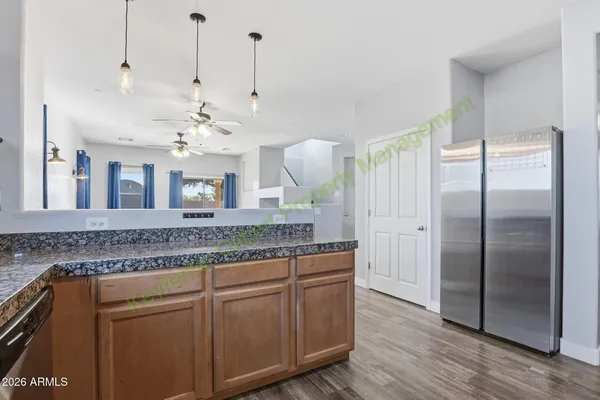 a view of kitchen and wooden floor