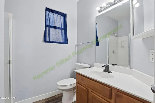 a kitchen with kitchen island granite countertop a sink cabinets and window