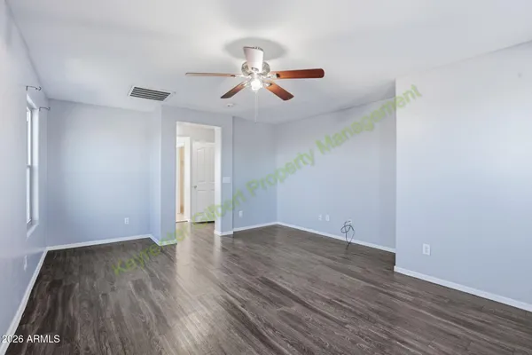 a view of an entryway with wooden floor
