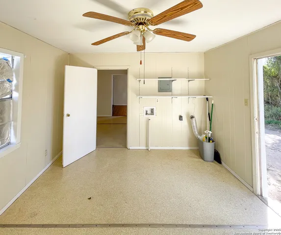 a kitchen with stainless steel appliances wooden cabinets and a sink
