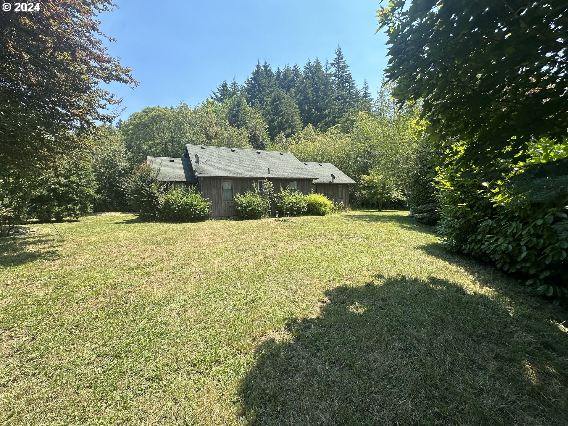 98368 Bridge Lane Myrtle Point, OR 97458 - Photo 31 of 37 a view of a house with a yard