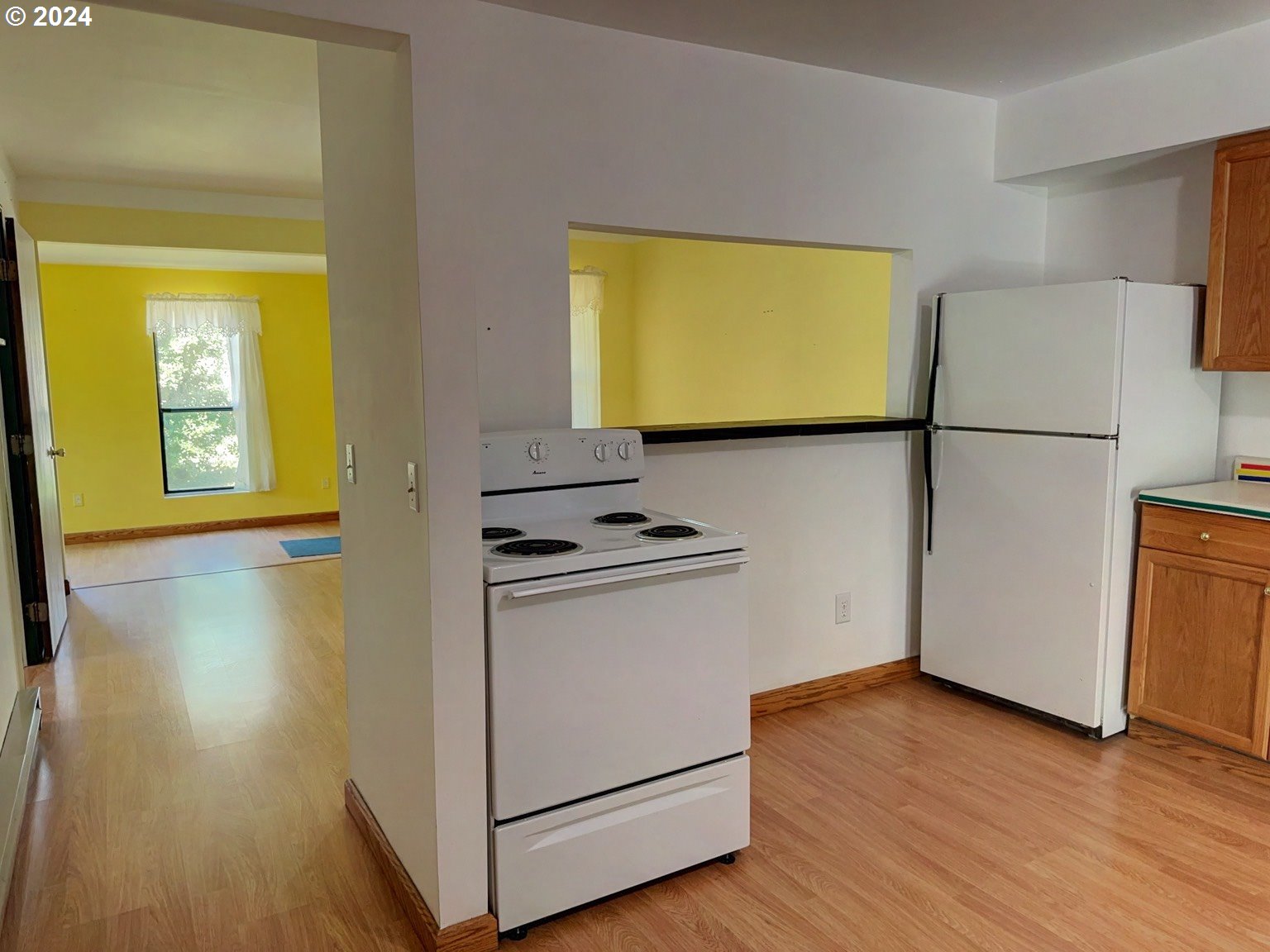 98368 Bridge Lane Myrtle Point, OR 97458 - Photo 9 of 37 a view of a kitchen with wooden floor and a sink