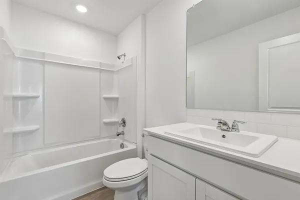 an empty room with a bathroom