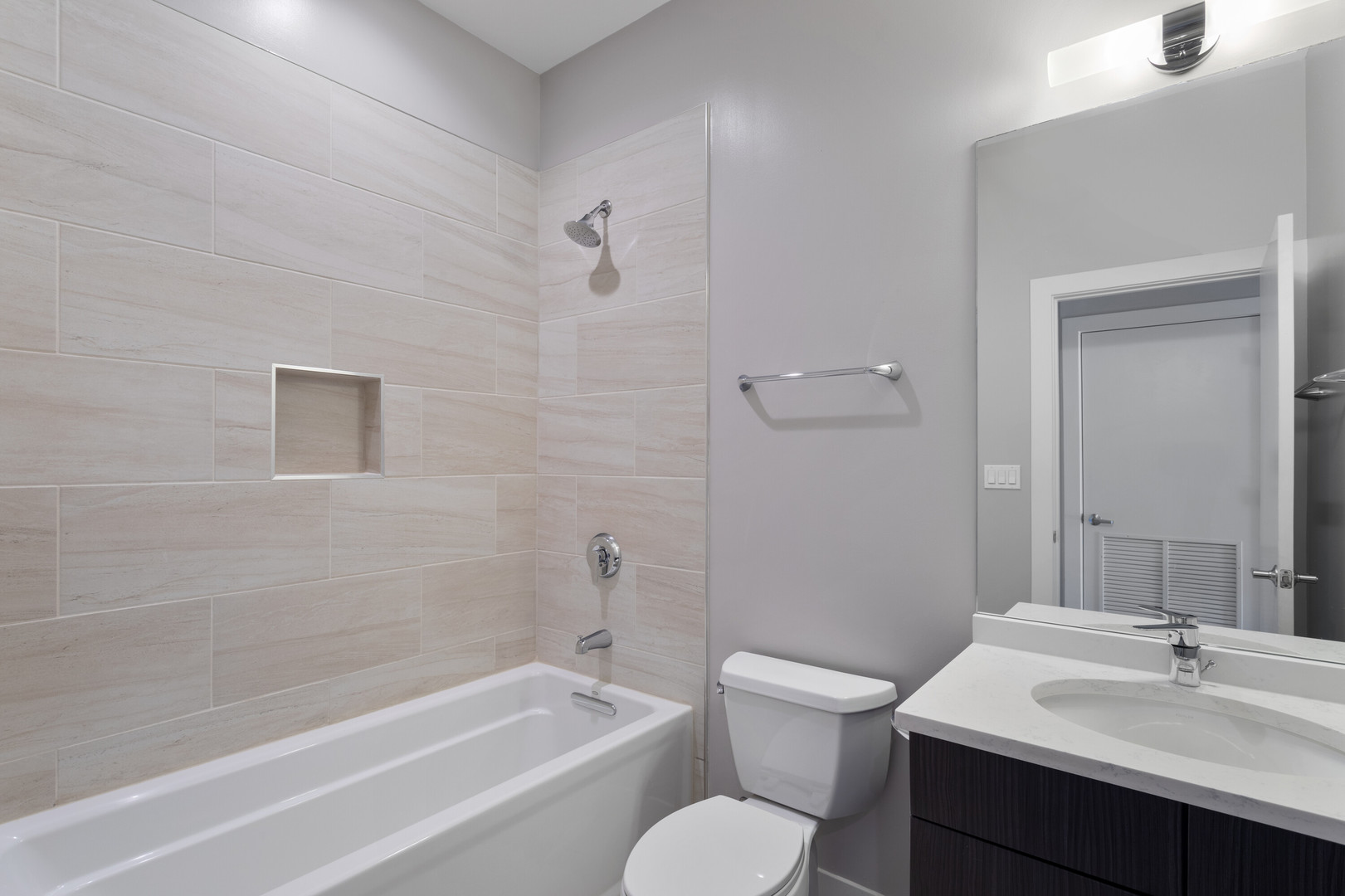 2518 West Addison Street, Unit 3W Chicago, IL 60618 - Photo 16 of 23 a bathroom with a sink toilet and shower