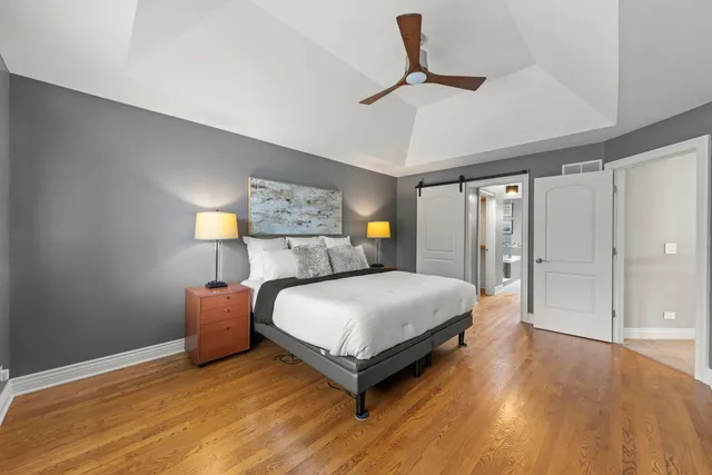 a bedroom with a bed and a table