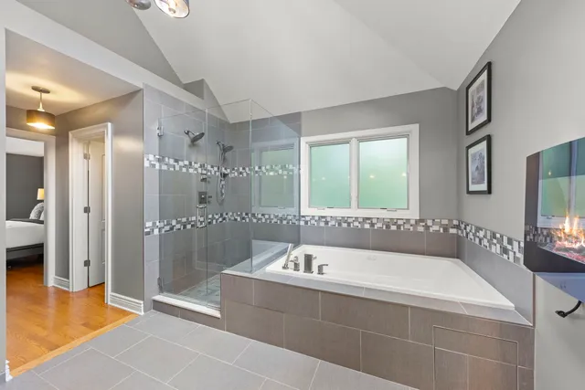 a bathroom with a tub and shower