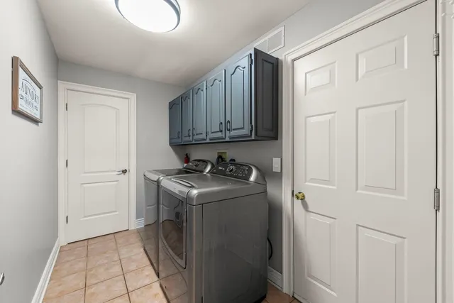 a utility room with cabinets